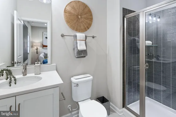 a bathroom with a toilet sink and shower