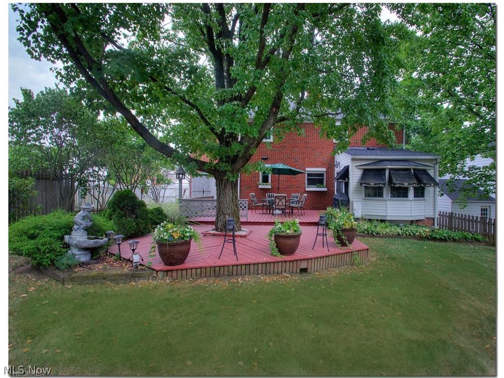 1443 Clearview Road Cleveland, OH 44124 - Photo 17 of 19 Rear view of 2 tiered deck. The room on the right, with awnings, is the Sunroom.