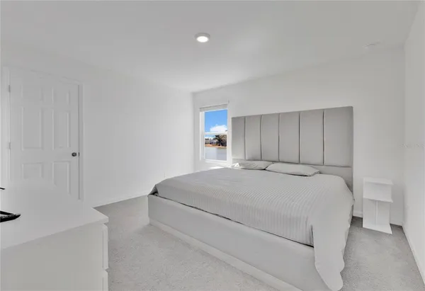 a room with a bed and a window