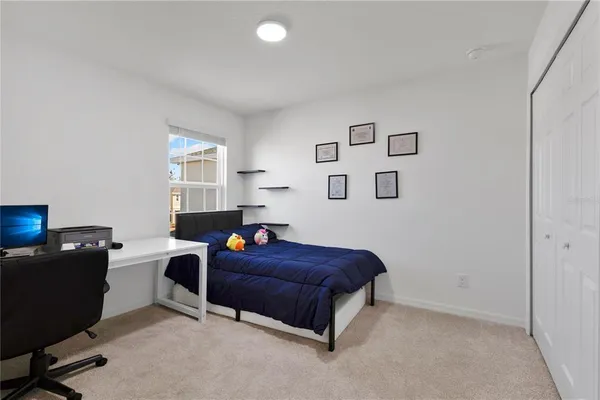 a bedroom with a bed and furniture