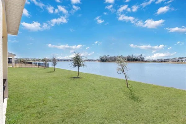a view of a lake with a big yard