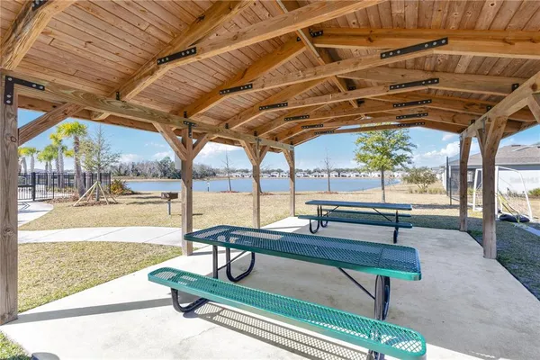 a view of a backyard with sitting area