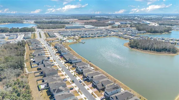 an aerial view of a house with a lake view