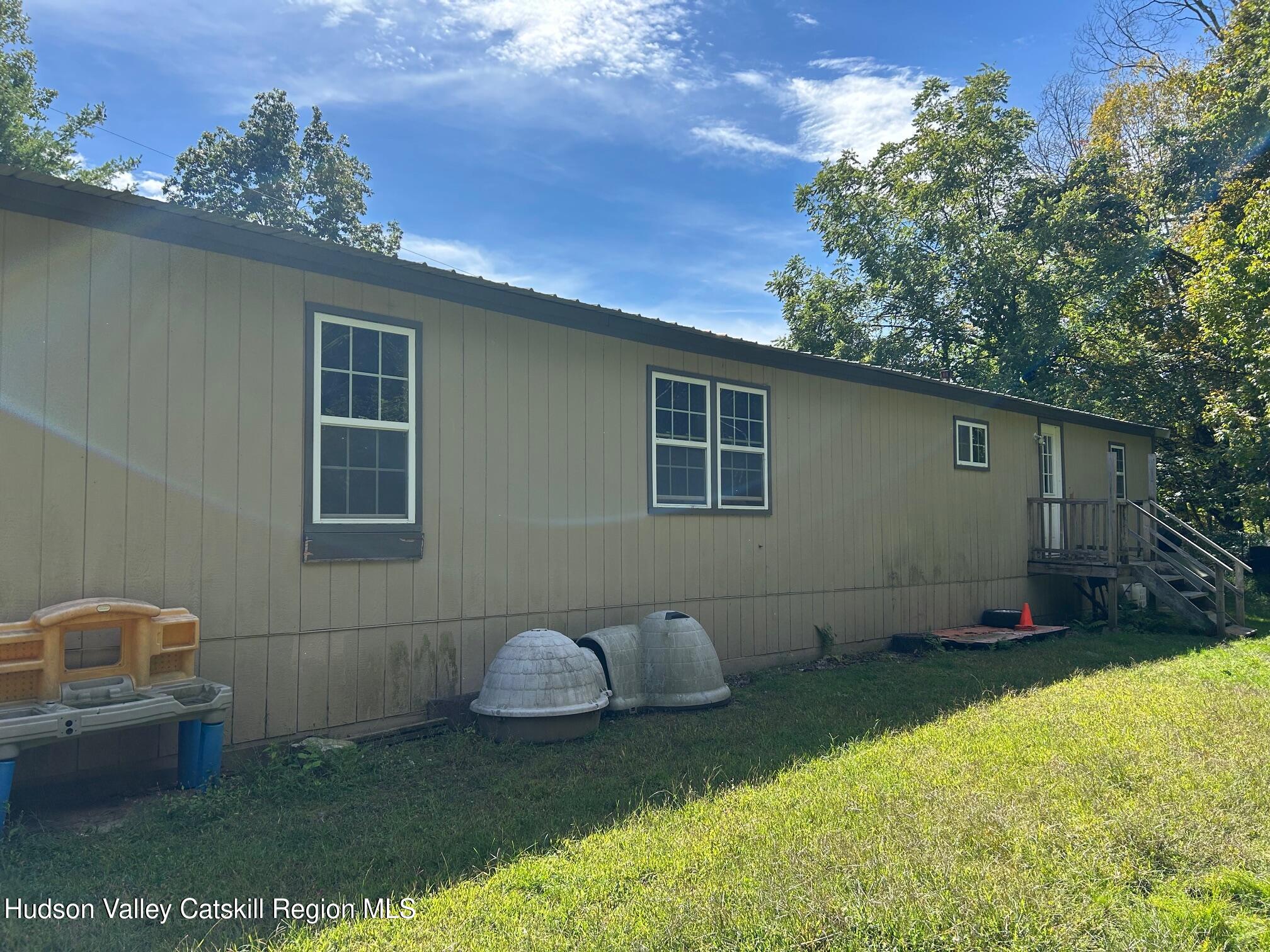 26 Iken Road Kerhonkson, NY 12446 - Photo 2 of 7 a house view with a backyard space