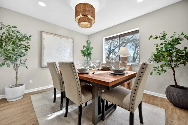 a view of a dining room with furniture window and wooden floor