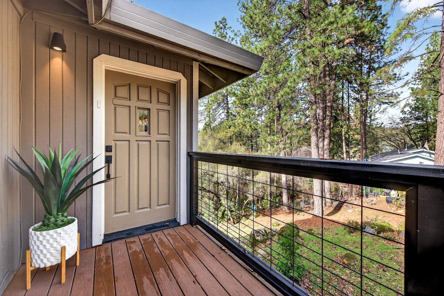 16947 Patricia Way Grass Valley, CA 95949 - Photo 2 of 50 a view of a porch with furniture and garden