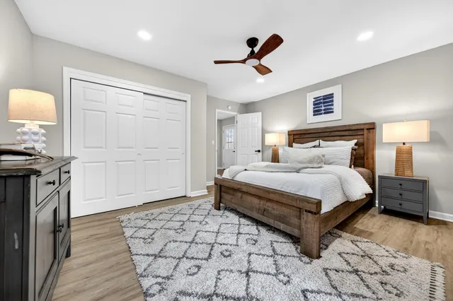 a bedroom with a bed and a dresser