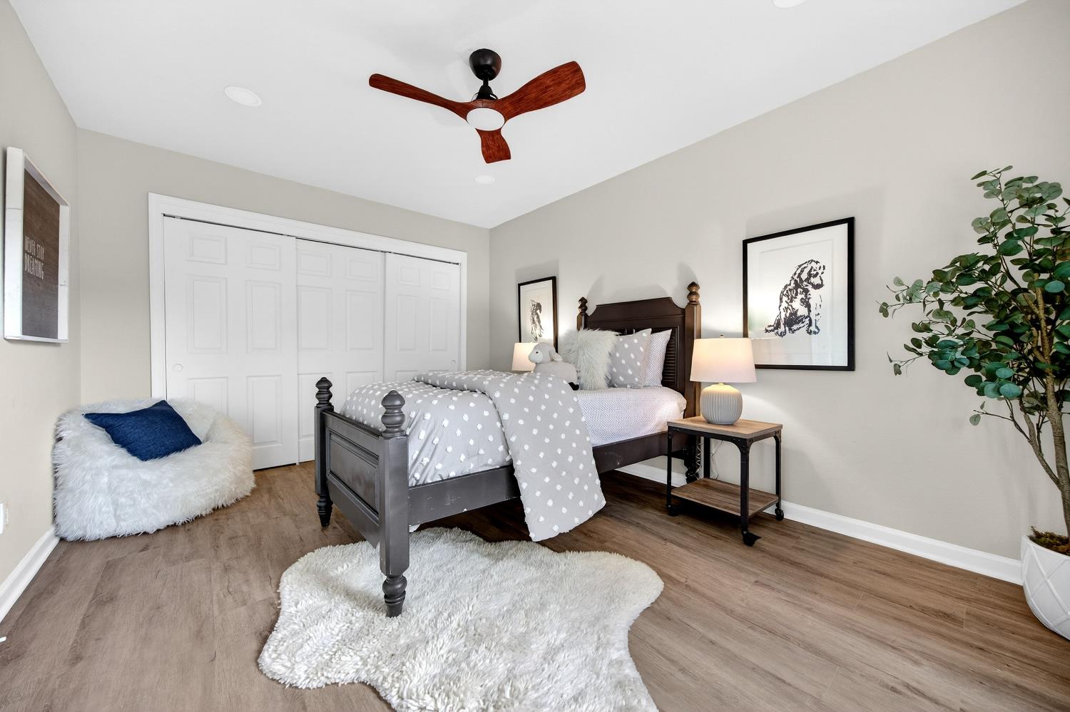 16947 Patricia Way Grass Valley, CA 95949 - Photo 29 of 50 a bedroom with furniture and a wooden floor