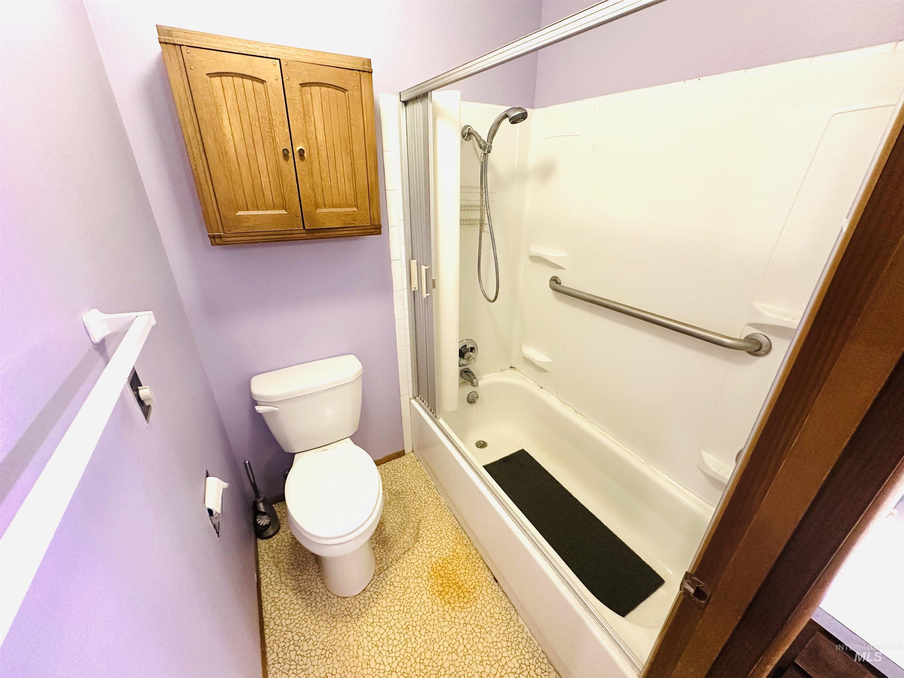 1111 West D Street Vale, OR 97918 - Photo 17 of 26 Bathroom featuring toilet and shower / bathtub combination