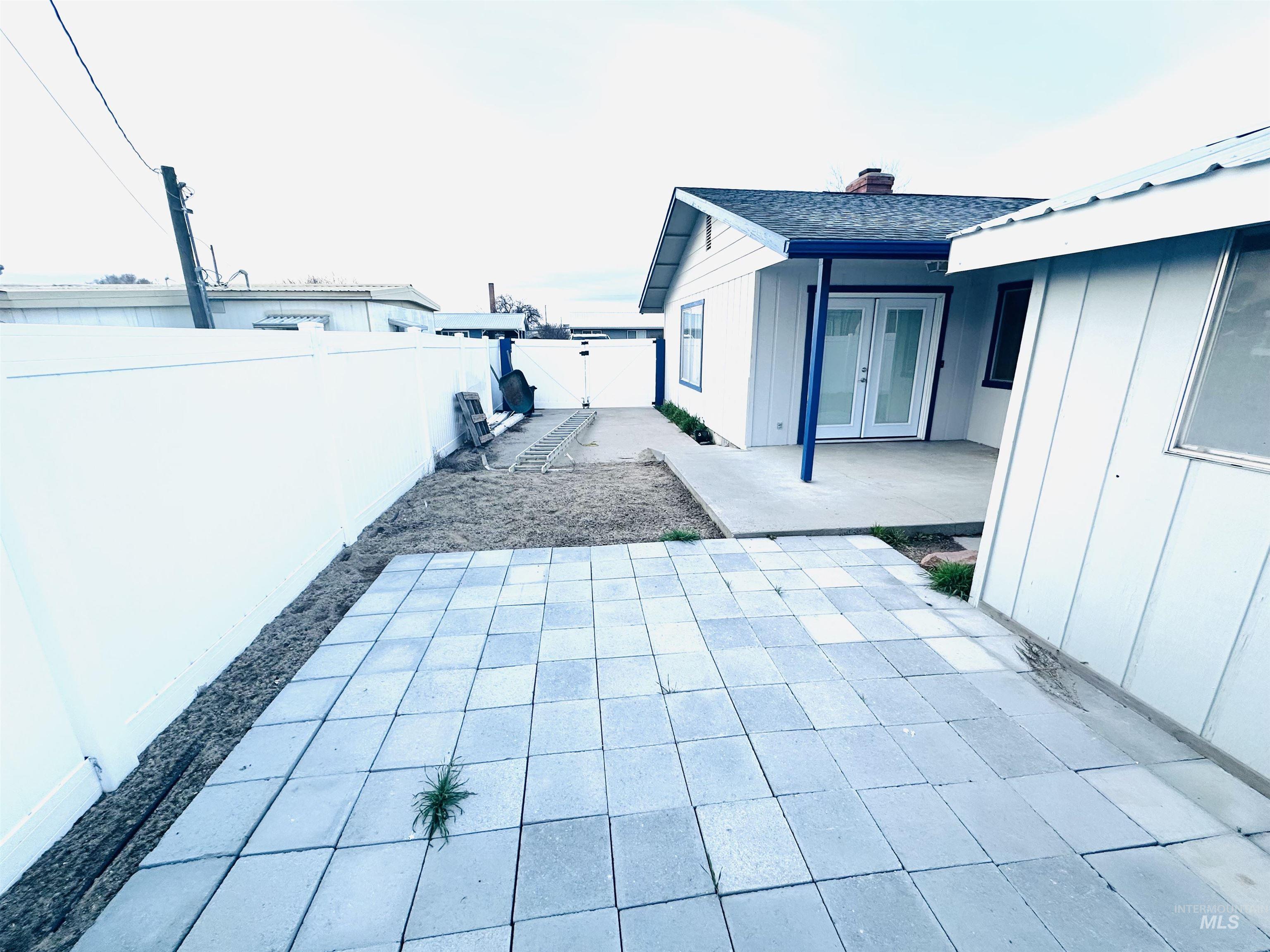 1111 West D Street Vale, OR 97918 - Photo 26 of 26 Fenced backyard featuring french doors and a patio area