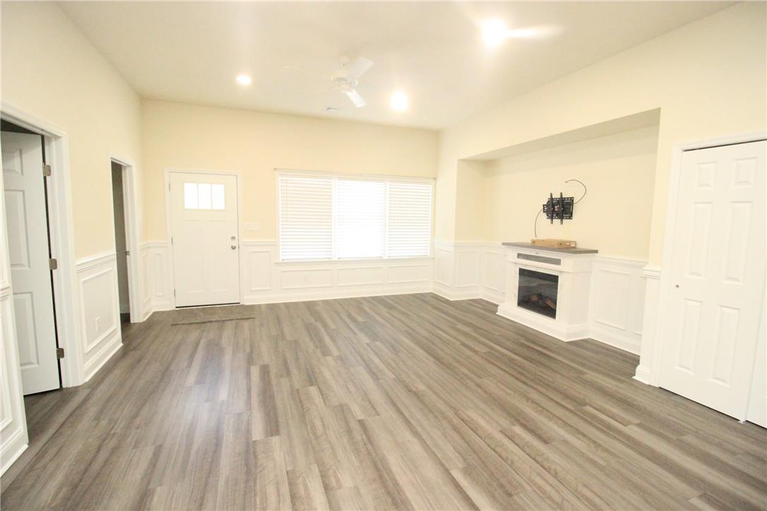 3083 Penn Allen Road, Unit B Nazareth, PA 18064 - Photo 3 of 21 A well-lit living space features neutral tones and stylish wood-look flooring.
