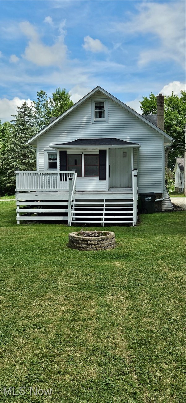 51 North Seneca Street Rittman, OH 44270 - Photo 4 of 17 View of rear facade featuring a back yard, and large deck