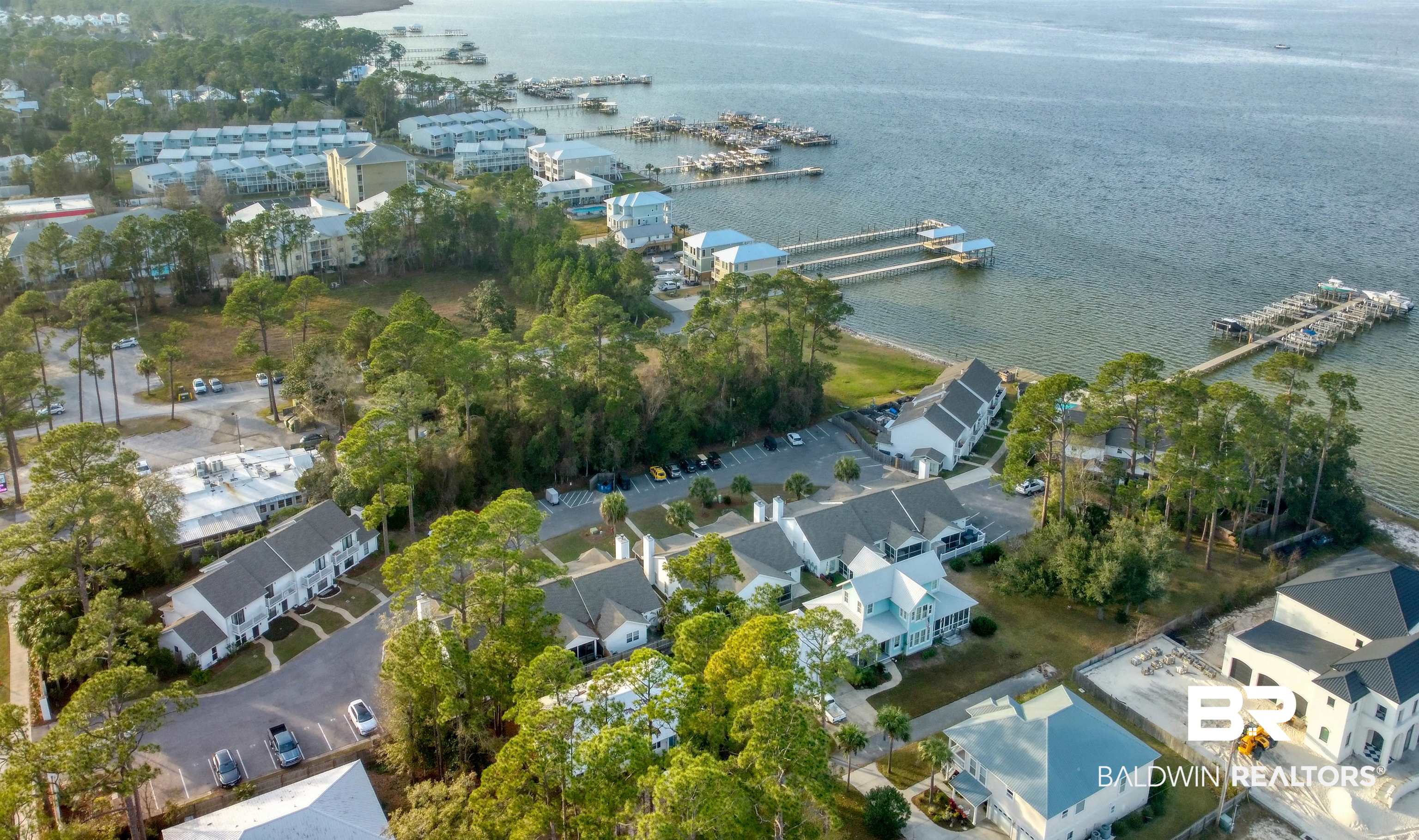 26063 Canal Road, Unit C2 Orange Beach, AL 36561 - Photo 29 of 30 Aerial view of property and surrounding area featuring a marina and a nearby body of water