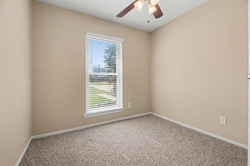 1024 South Riverside Drive Grapevine, TX 76051 - Photo 16 of 21 an empty room with a window