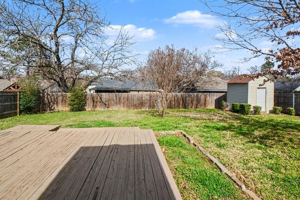 1024 South Riverside Drive Grapevine, TX 76051 - Photo 20 of 21 a view of a backyard with a garden