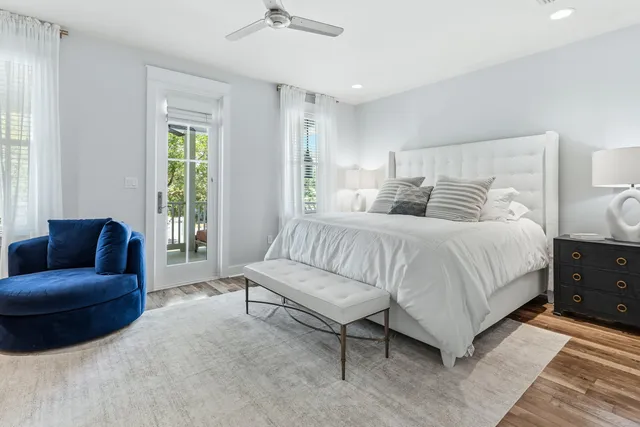 a balcony with wooden floor and outdoor seating