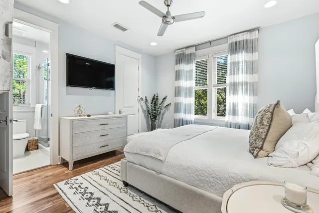 a bathroom with a toilet a sink and a window
