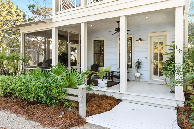 a dining room with furniture a chandelier and wooden floor