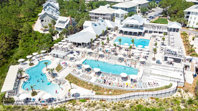 a aerial view of a house with a yard basket ball court and outdoor seating