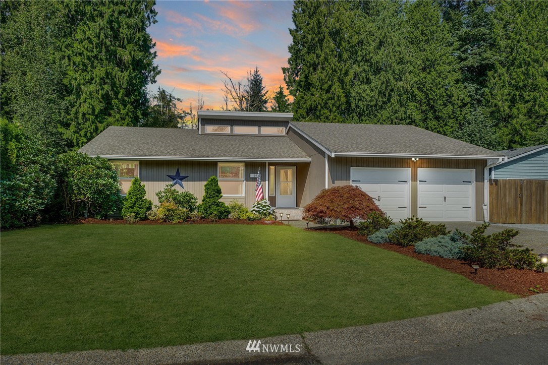1912 169th Place Southeast Bothell, WA 98012 - Photo 1 of 40 a front view of a house with garden