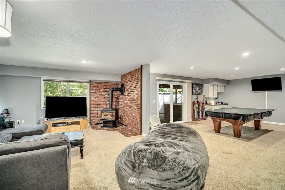 1912 169th Place Southeast Bothell, WA 98012 - Photo 20 of 40 a living room with furniture and a flat screen tv