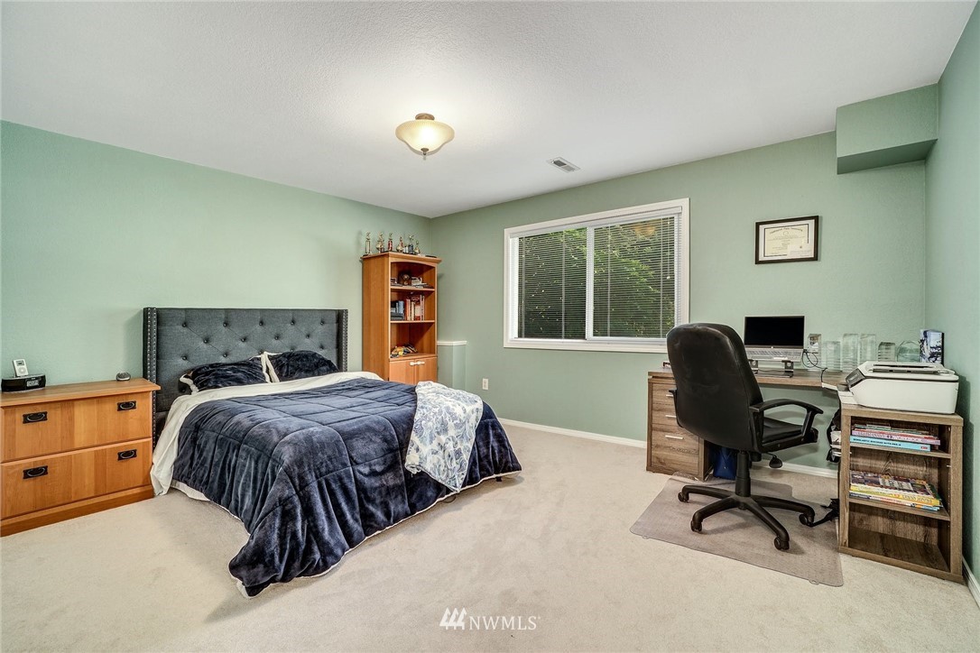 1912 169th Place Southeast Bothell, WA 98012 - Photo 23 of 40 a bedroom with a bed and a desk