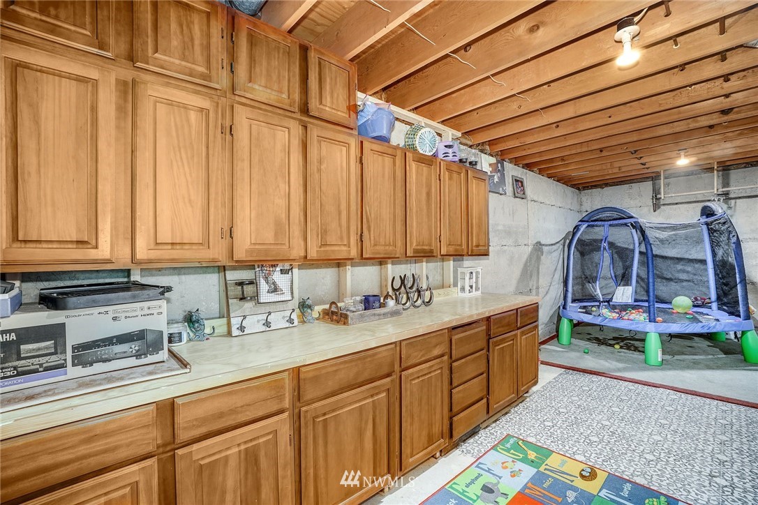1912 169th Place Southeast Bothell, WA 98012 - Photo 24 of 40 a kitchen with lots of counter top space and cabinets