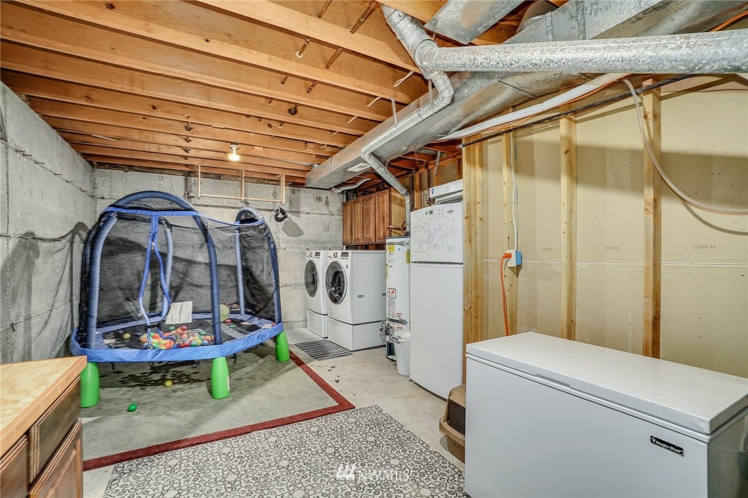 1912 169th Place Southeast Bothell, WA 98012 - Photo 25 of 40 a view of a hallway with washer and dryer