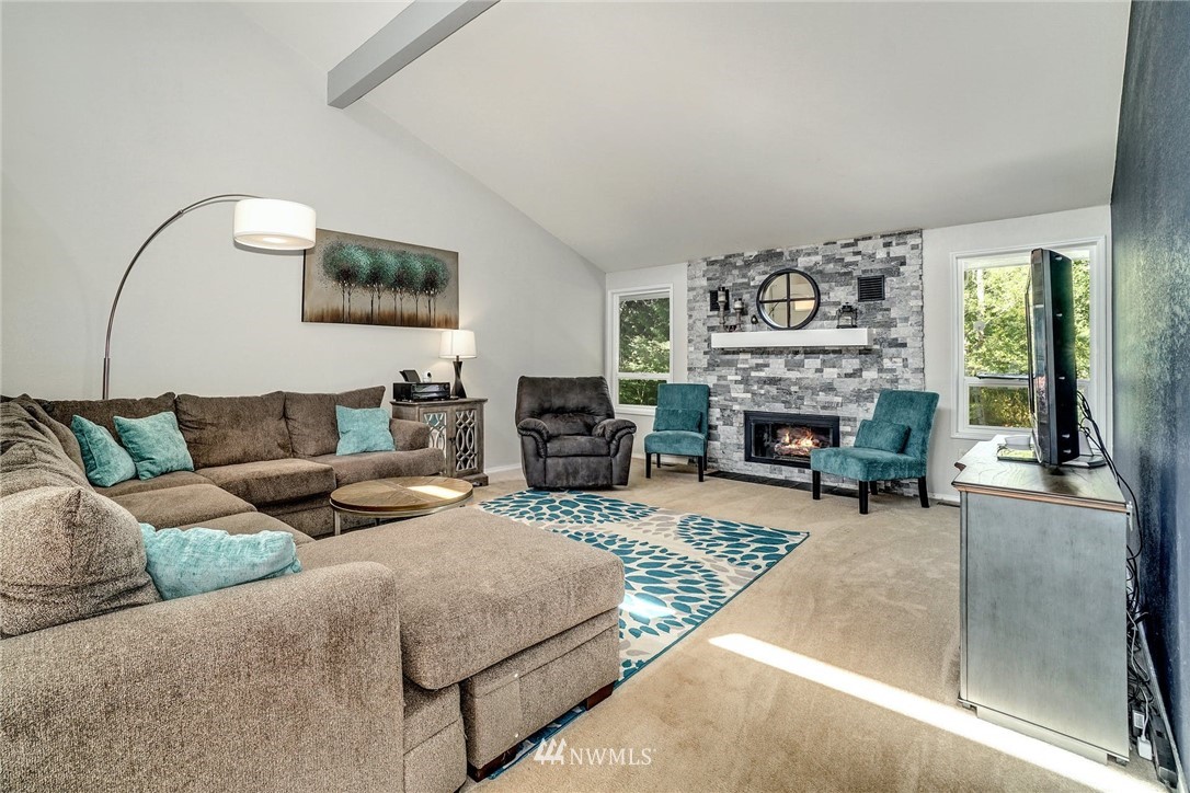 1912 169th Place Southeast Bothell, WA 98012 - Photo 6 of 40 a living room with furniture and a fireplace