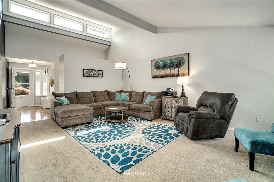 1912 169th Place Southeast Bothell, WA 98012 - Photo 7 of 40 a living room with furniture and a couch