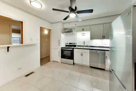a view of a kitchen with a sink and dishwasher kitchen view