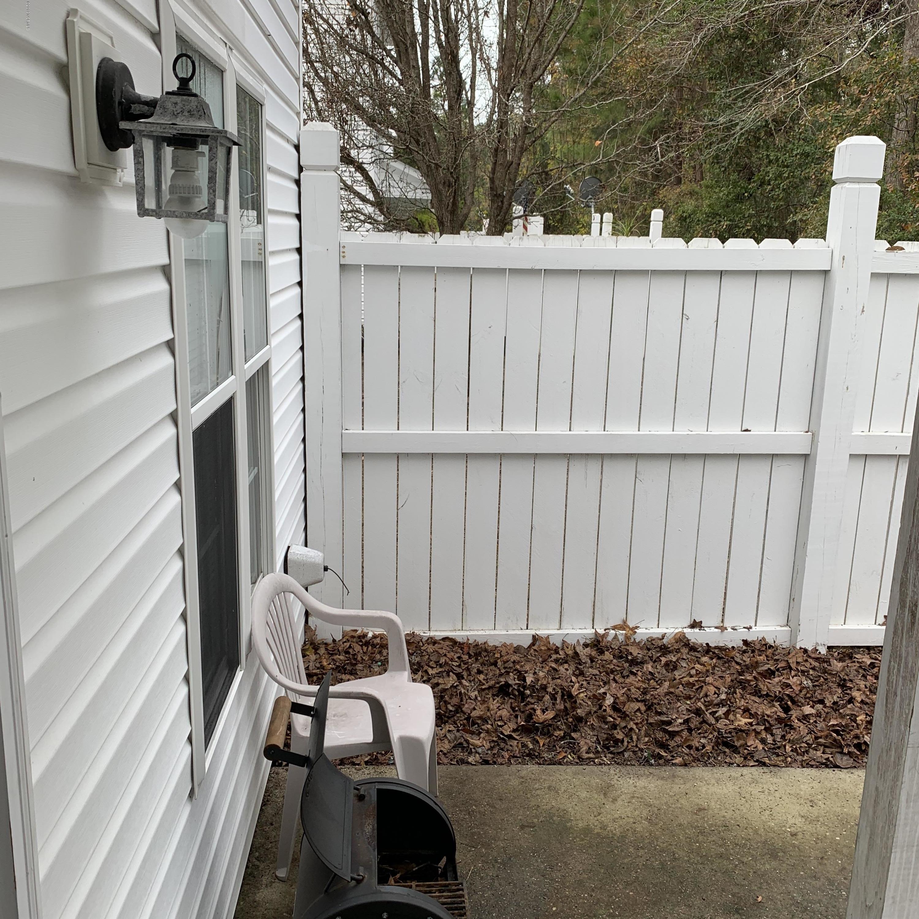 4910 Bridger Road, Unit #14 Shallotte, NC 28470 - Photo 16 of 37 Fenced in Backyard