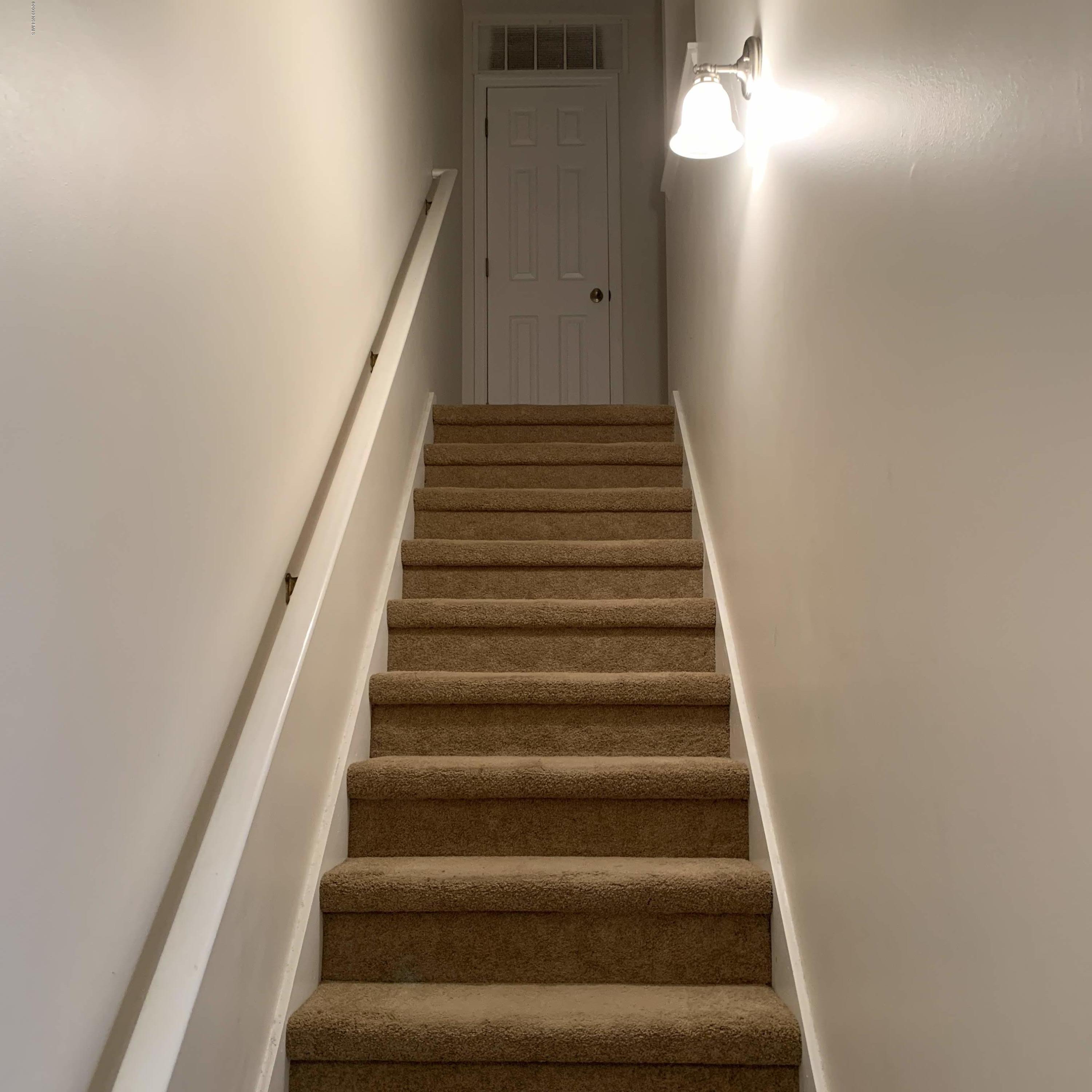 4910 Bridger Road, Unit #14 Shallotte, NC 28470 - Photo 18 of 37 Stairway to 2 Bedrooms 2 Full Bathrooms and Laundry Room