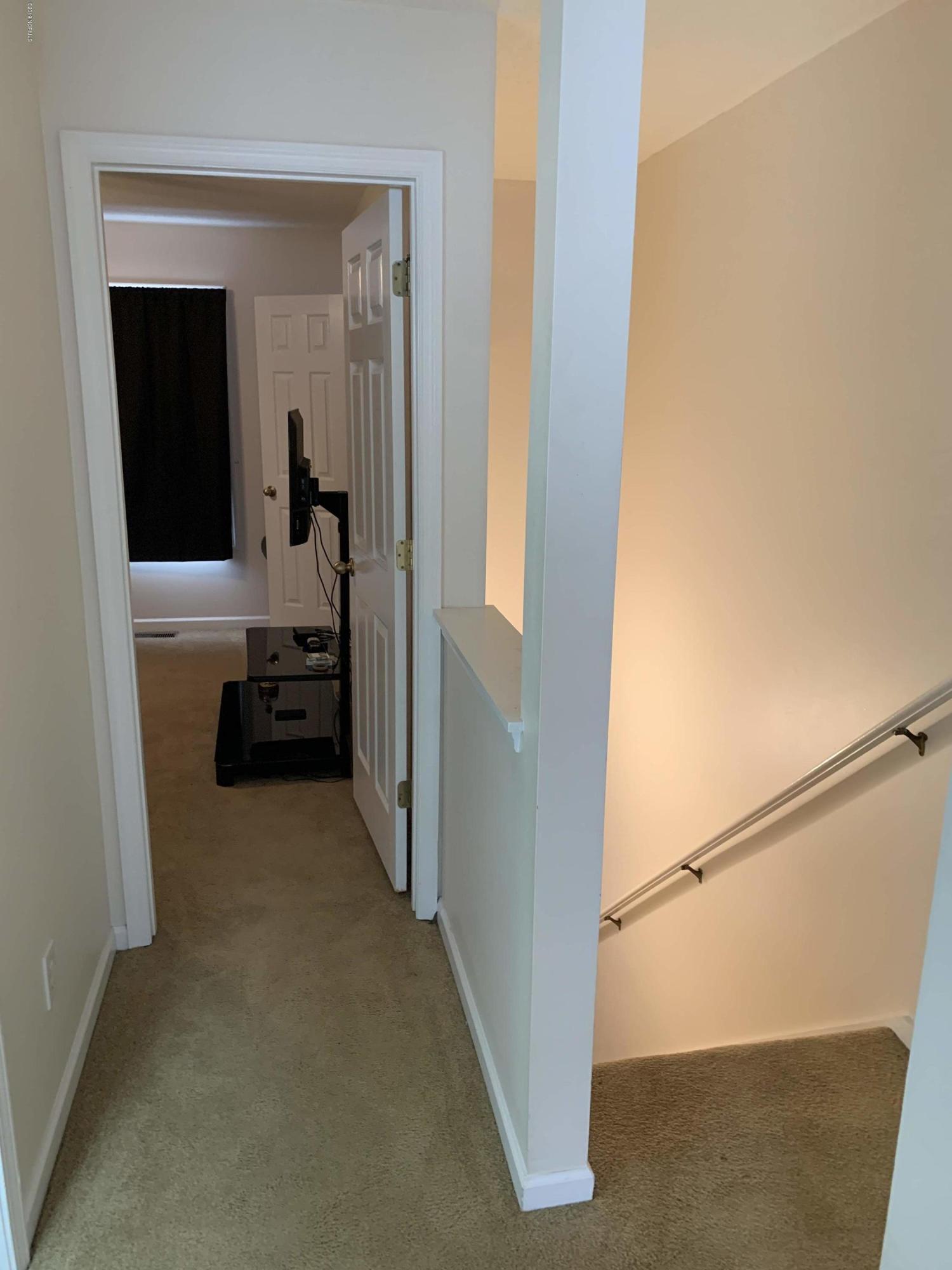 4910 Bridger Road, Unit #14 Shallotte, NC 28470 - Photo 19 of 37 Upstairs Hallway to front and rear Bedrooms and Laundry Room
