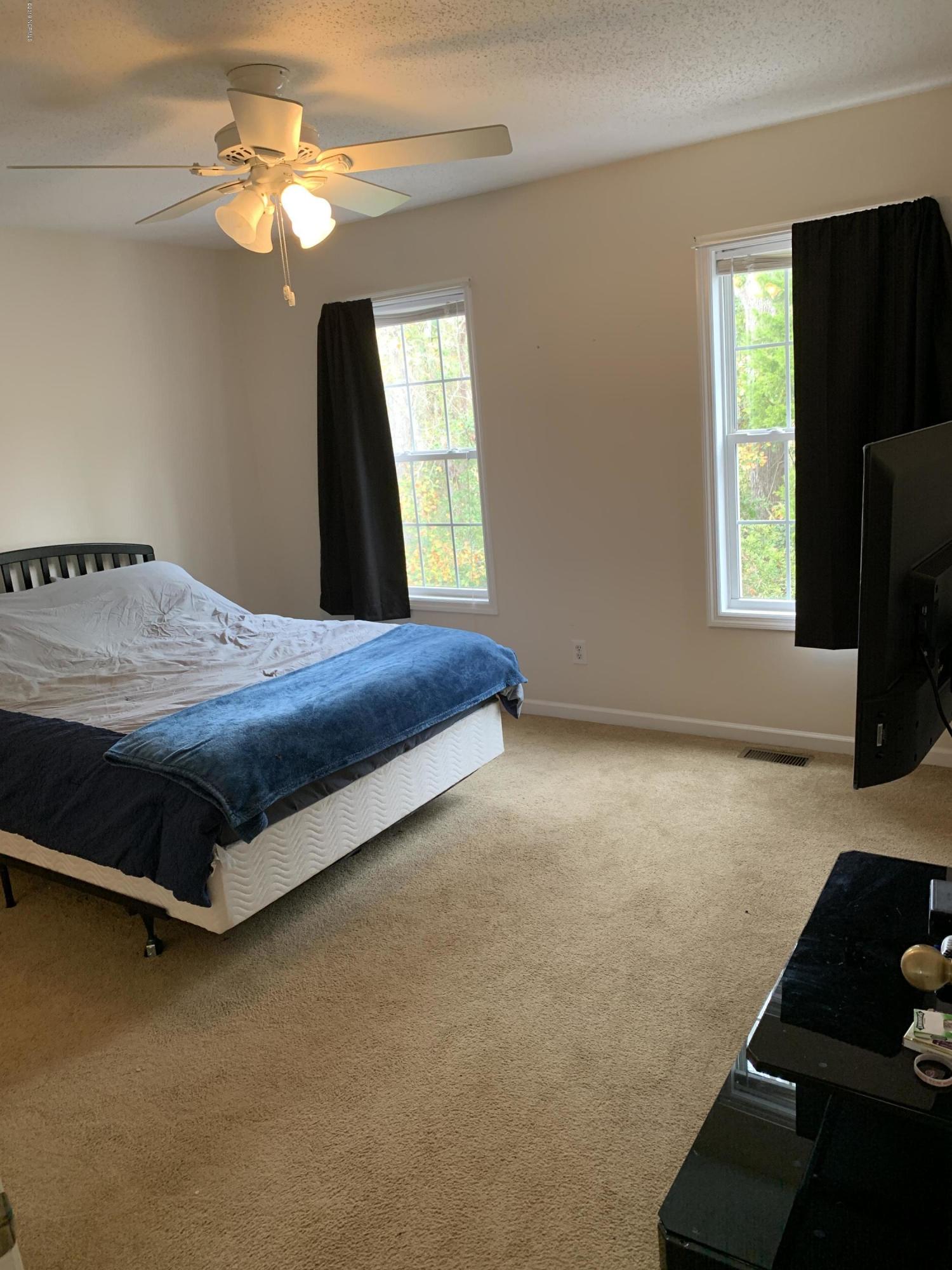 4910 Bridger Road, Unit #14 Shallotte, NC 28470 - Photo 20 of 37 Upstairs Rear Bedroom