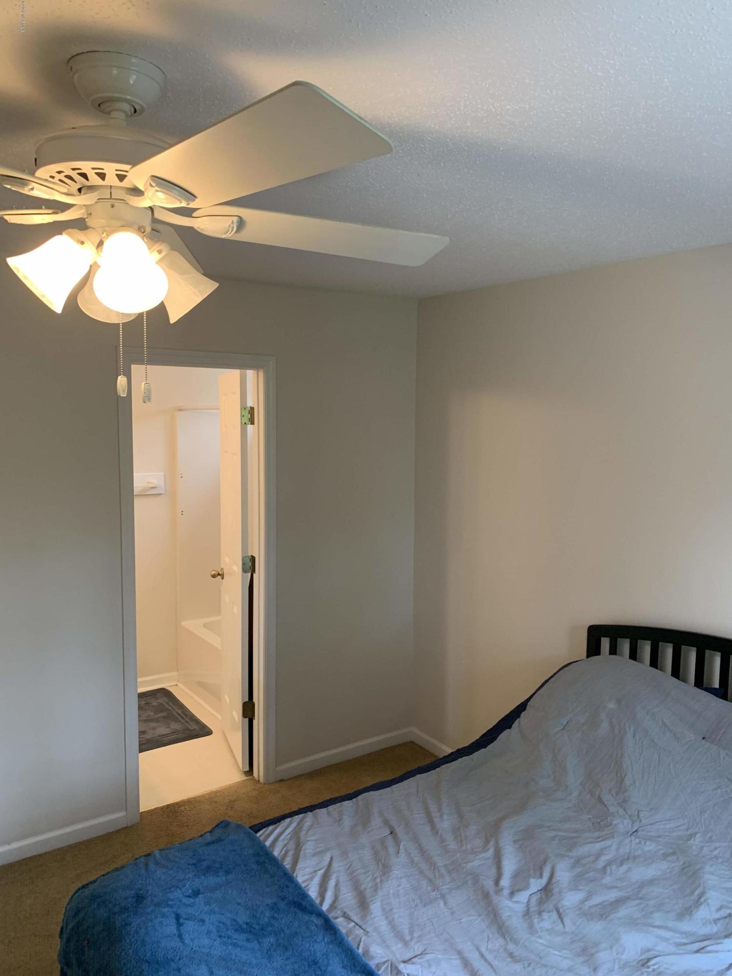 4910 Bridger Road, Unit #14 Shallotte, NC 28470 - Photo 21 of 37 Rear Bedroom with Full Bathroom