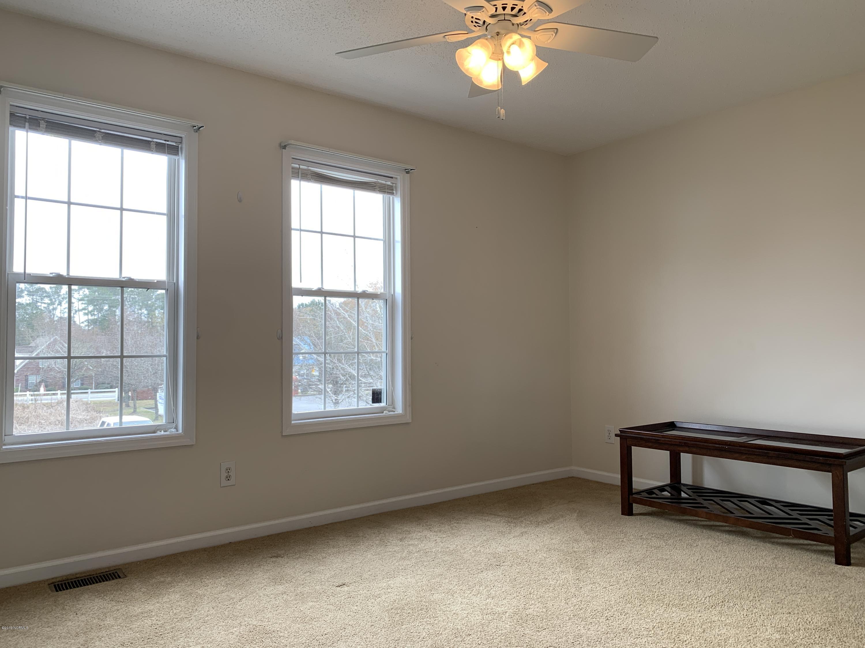 4910 Bridger Road, Unit #14 Shallotte, NC 28470 - Photo 24 of 37 Upstairs Front Bedroom