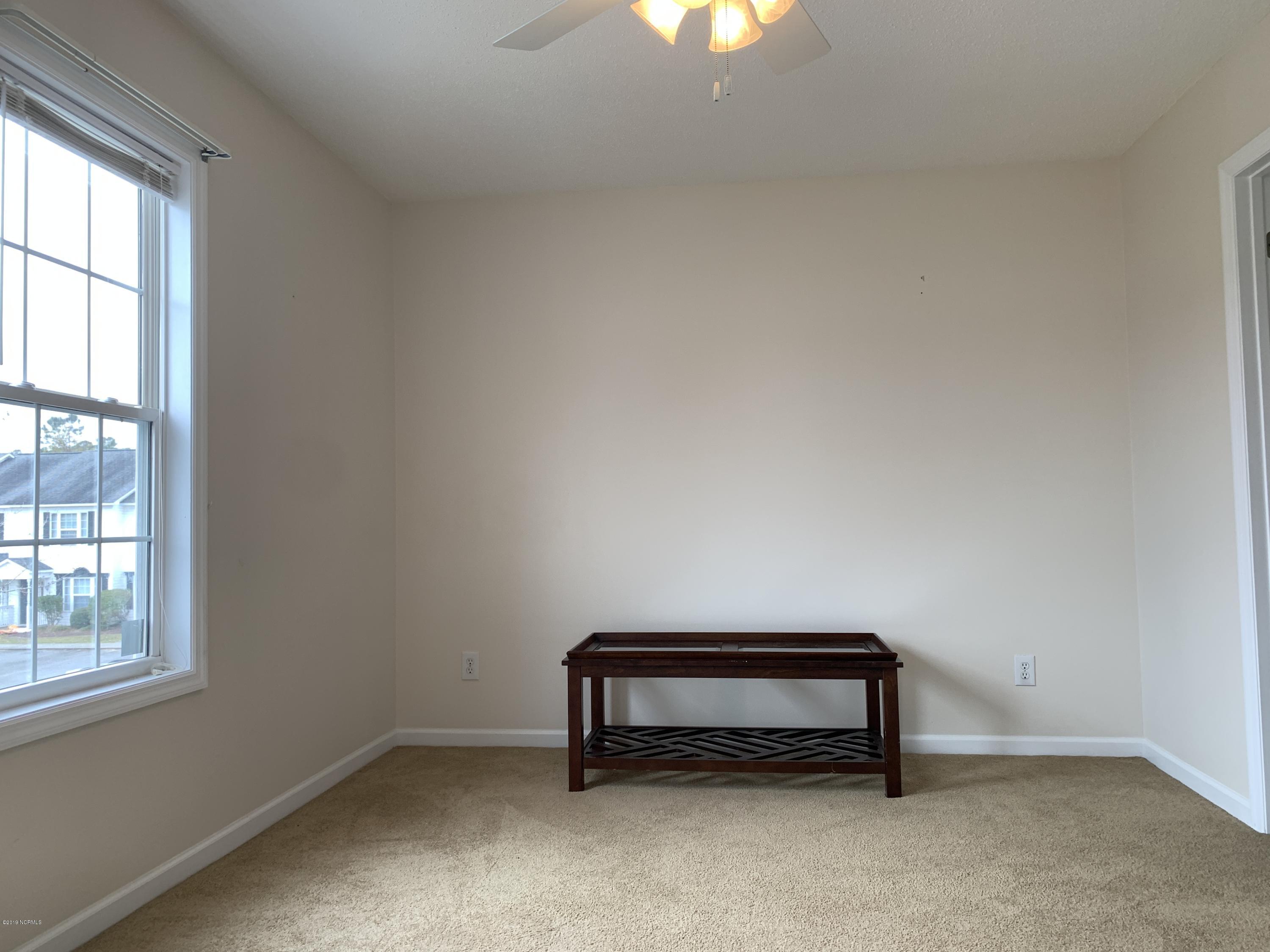4910 Bridger Road, Unit #14 Shallotte, NC 28470 - Photo 25 of 37 Upstairs Front Bedroom