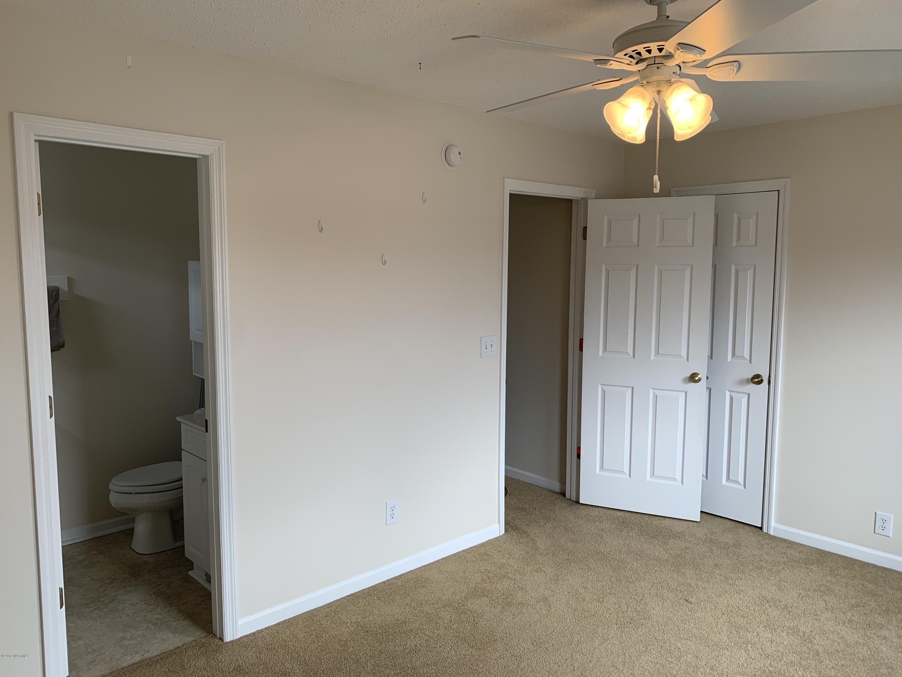 4910 Bridger Road, Unit #14 Shallotte, NC 28470 - Photo 26 of 37 Upstairs Front Bedroom