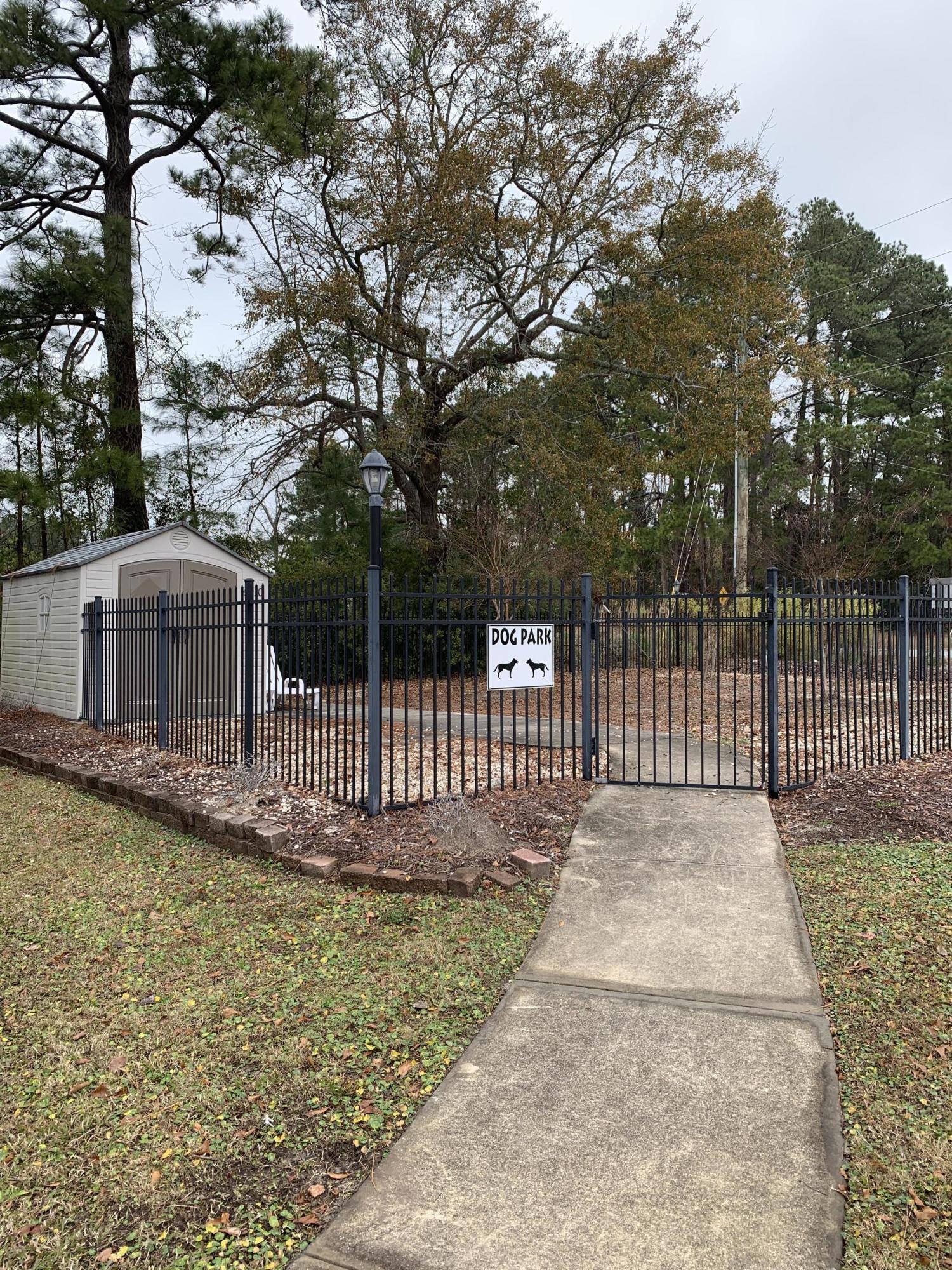 4910 Bridger Road, Unit #14 Shallotte, NC 28470 - Photo 31 of 37 Fenced in Dog Park