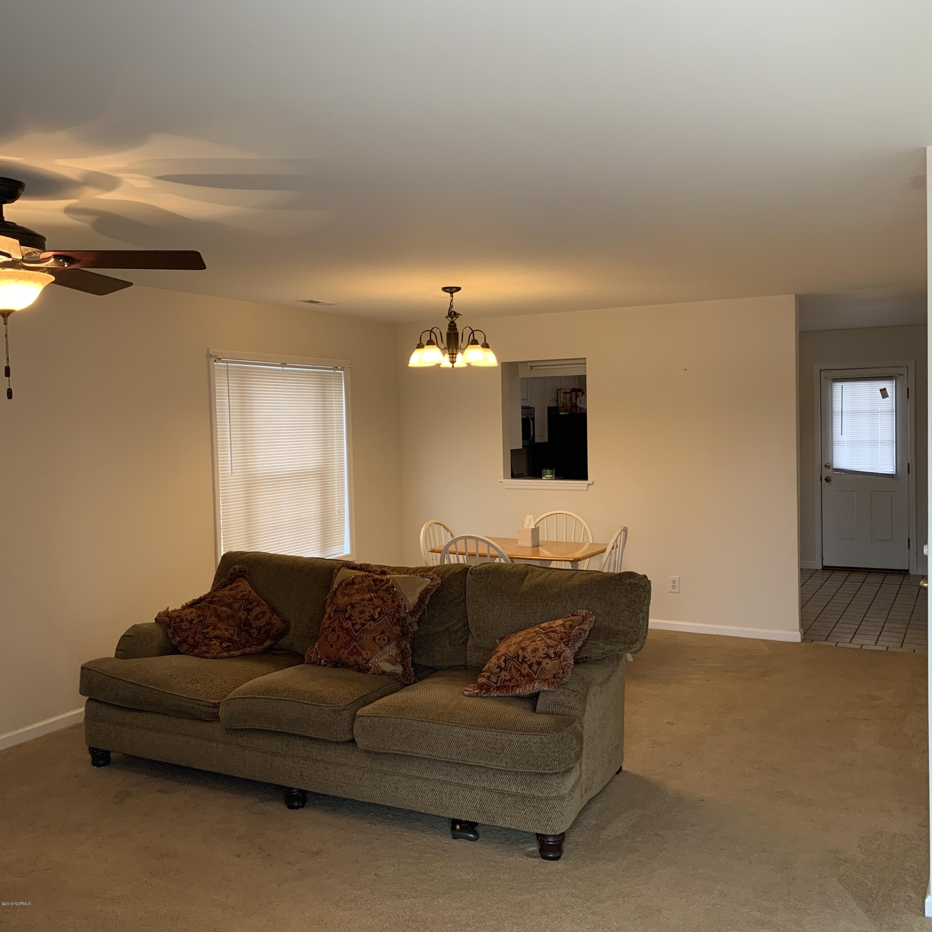 4910 Bridger Road, Unit #14 Shallotte, NC 28470 - Photo 9 of 37 Living Room with paddle fan