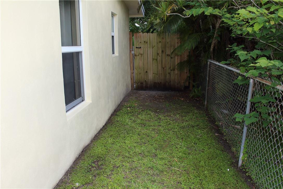 5620 Simms Street Hollywood, FL 33021 - Photo 7 of 30 West side of house leading to back yard