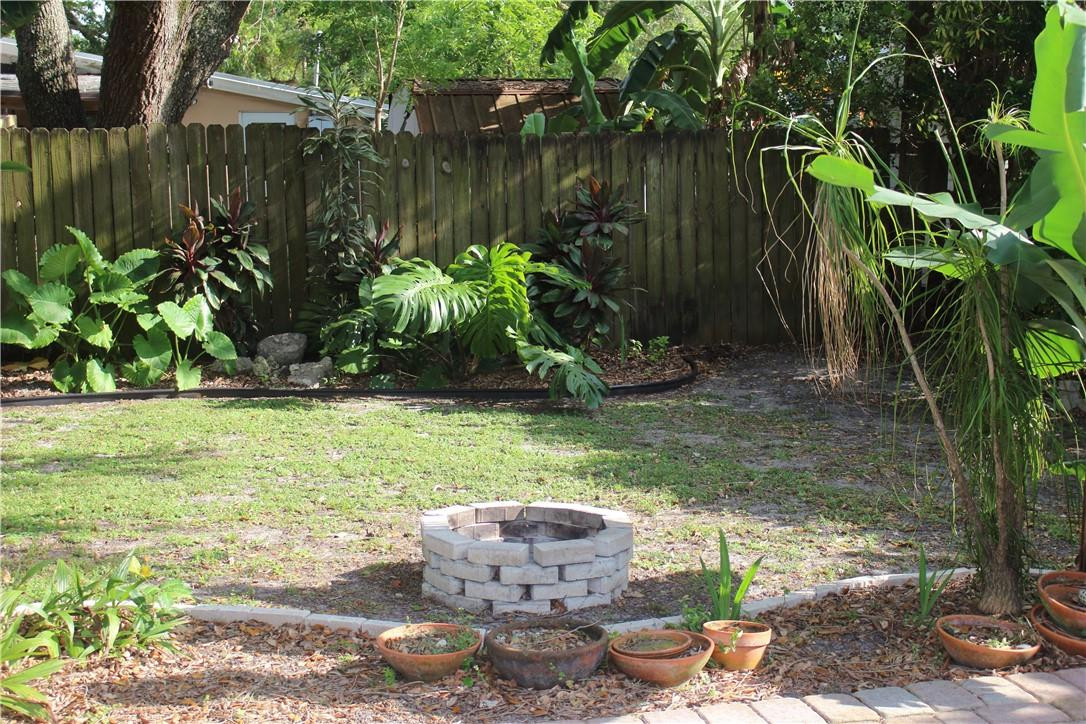 5620 Simms Street Hollywood, FL 33021 - Photo 9 of 30 Fire Pit and lush landscaping