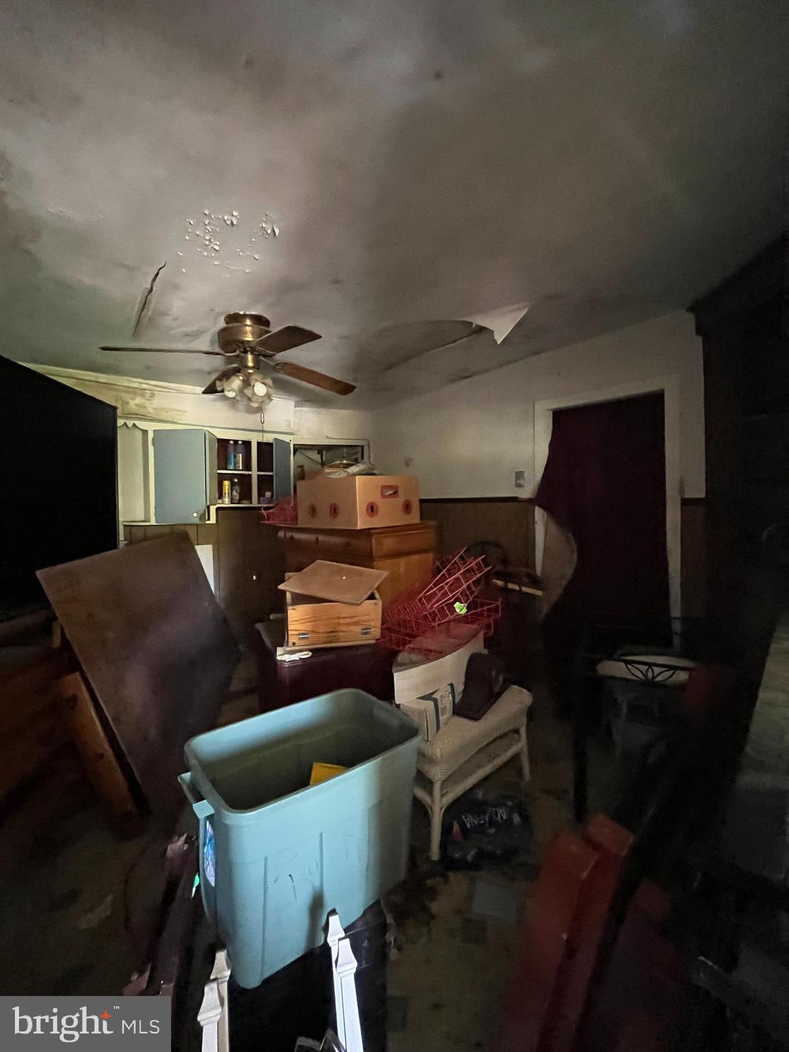 484 Gum Tree Corner Road Bridgeton, NJ 08302 - Photo 10 of 29 a garage with a chair and white walls