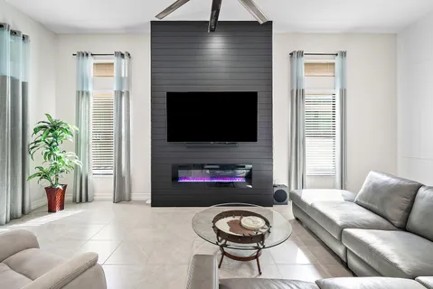 a living room with furniture and a flat screen tv