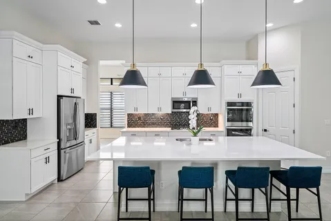 a view of a dining room with furniture and a window