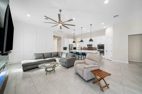 an empty room with a fireplace and wooden floor