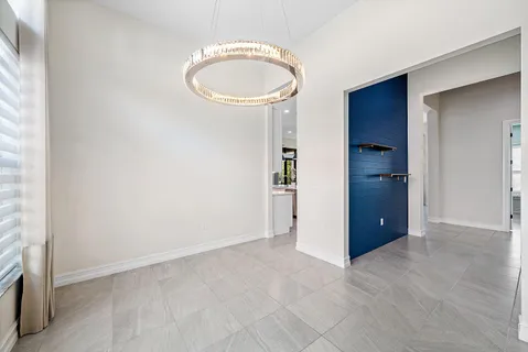 a view of kitchen with windows and refrigerator