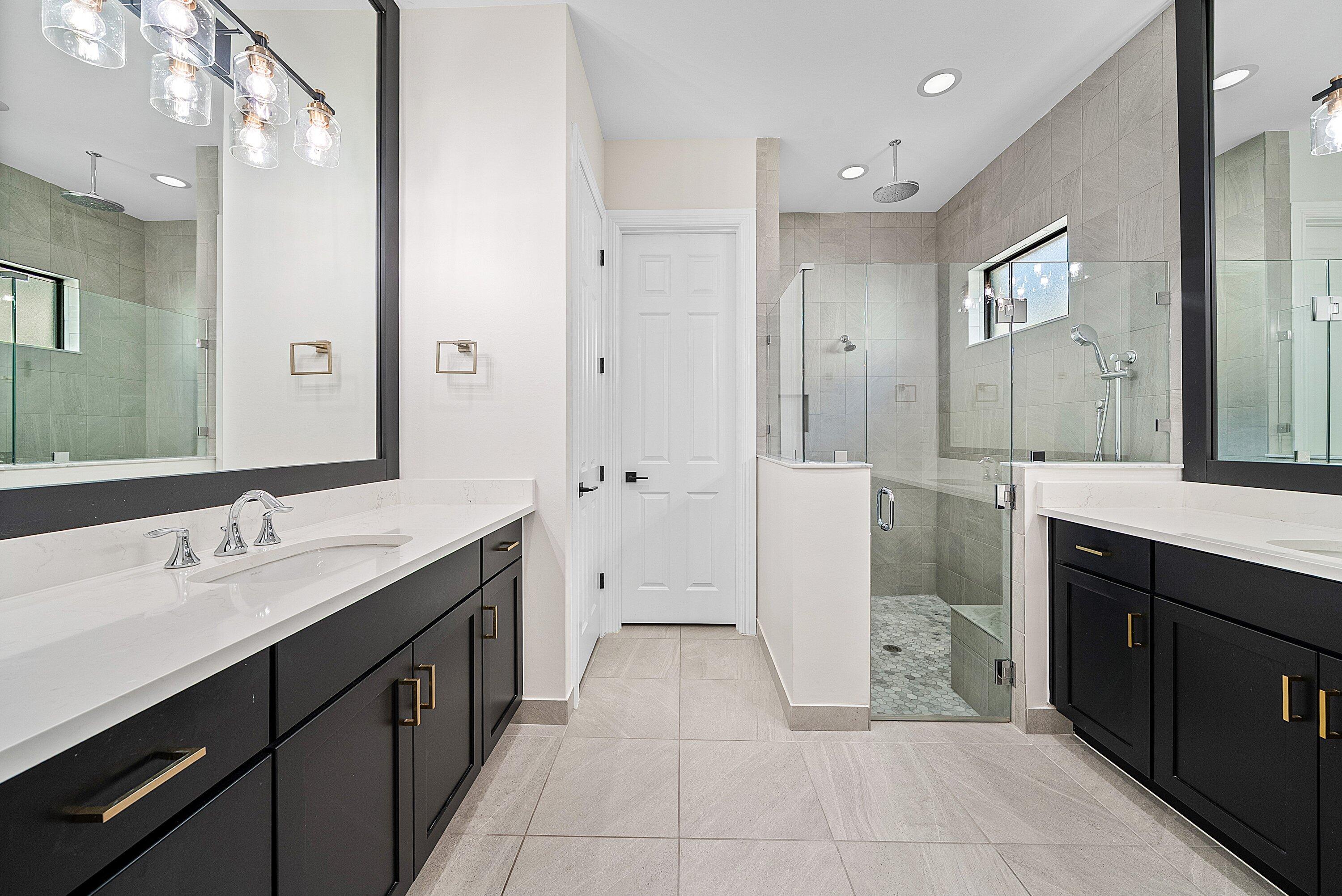 9076 Leon Circle Parkland, FL 33076 - Photo 26 of 42 a spacious bathroom with a double vanity sink mirror and double