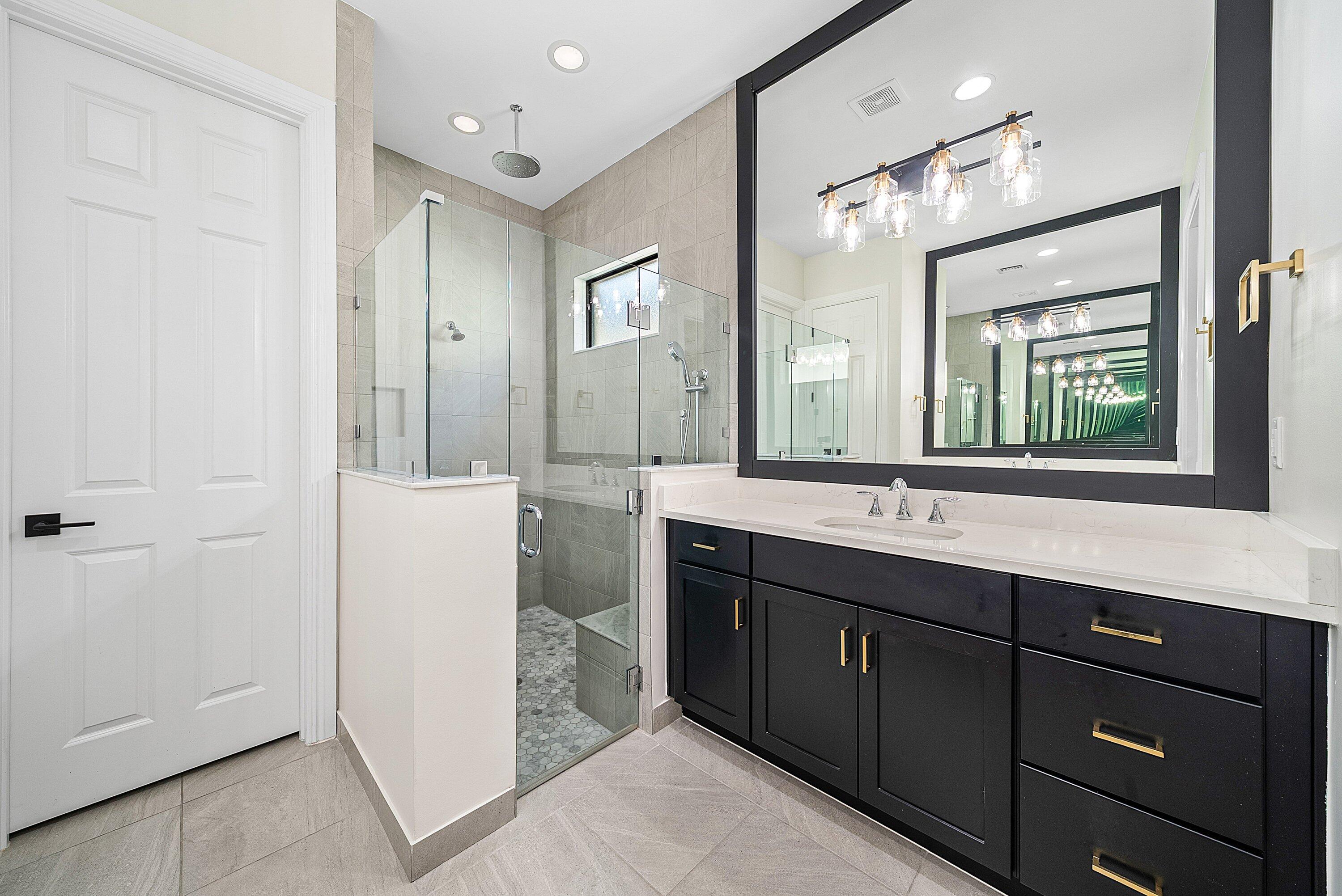 9076 Leon Circle Parkland, FL 33076 - Photo 27 of 42 a spacious bathroom with a double vanity sink mirror and